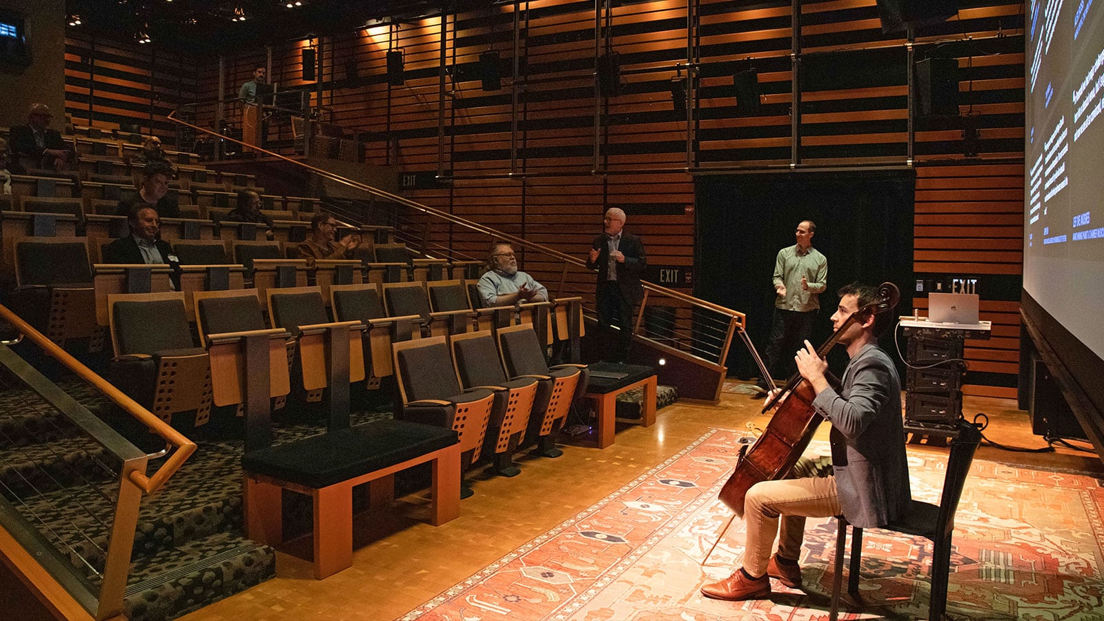 Rainer Eudeikis playing the cello in the Pearson Theatre